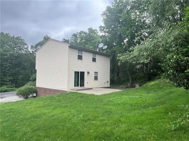 742 King St, Mckeesport, PA 15132 - rear view of house featuring a patio area and a lawn