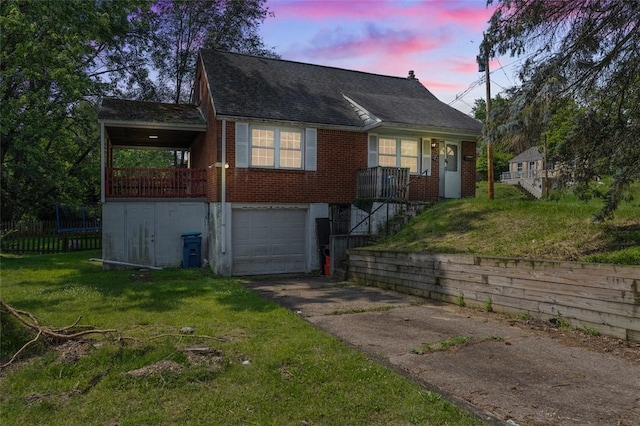 301 Pennview Dr, Penn Hills, PA 15235 - view of front facade featuring driveway, a front lawn, brick siding, a garage, and a shingled roof