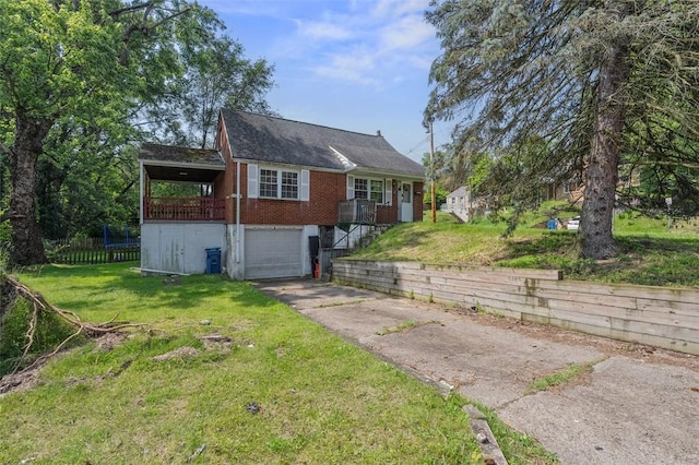 301 Pennview Dr, Penn Hills, PA 15235 - view of front facade with driveway, a front yard, a garage, and brick siding