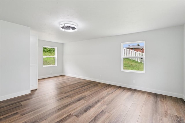 105 Becks Run Rd, Moon/Crescent Twp, PA 15108 - spare room featuring wood finished floors and baseboards