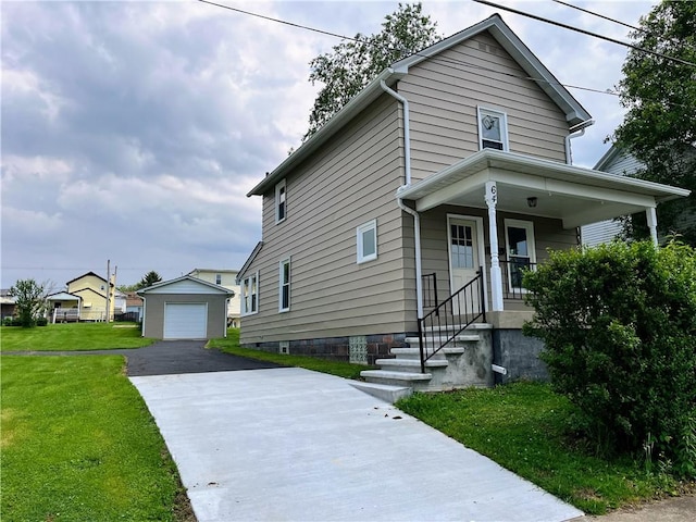 64 Beech St, Center Twp/Homer Cty, PA 15748 - view of front of home with driveway, a detached garage, an outbuilding, a front yard, and covered porch