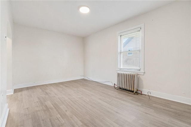 3937 Davis Ave, Munhall, PA 15120 - empty room featuring radiator and light wood finished floors