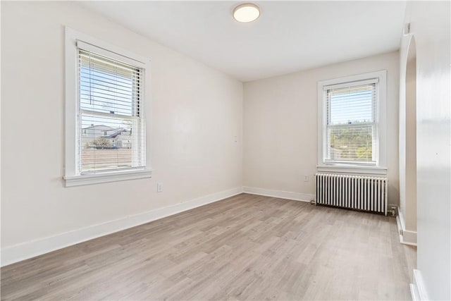 3937 Davis Ave, Munhall, PA 15120 - spare room with radiator heating unit and light wood-style flooring