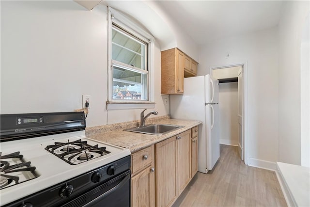 3937 Davis Ave, Munhall, PA 15120 - kitchen featuring white appliances, light brown cabinets, light wood finished floors, and light countertops