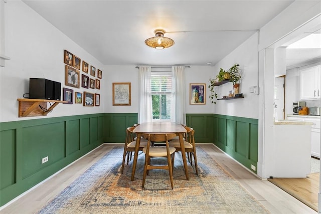 430 Lamar Ave, Regent Square, PA 15221 - dining area with light wood-style floors, wainscoting, and a decorative wall