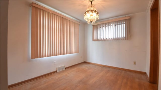 3550 Camp St, Hill District, PA 15219 - unfurnished room with a chandelier and wood finished floors