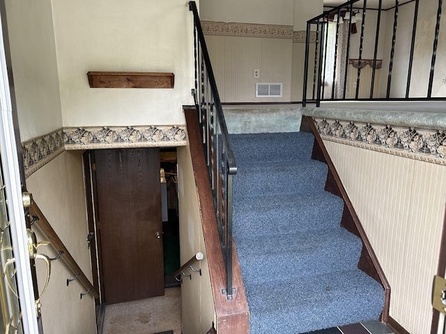307 Debora Dr, Latrobe, PA 15650 - staircase with carpet flooring and a wainscoted wall