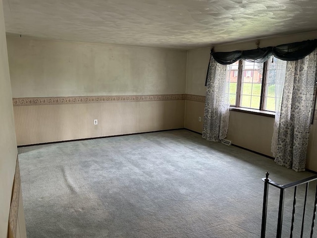 307 Debora Dr, Latrobe, PA 15650 - carpeted empty room with a textured ceiling and a wainscoted wall