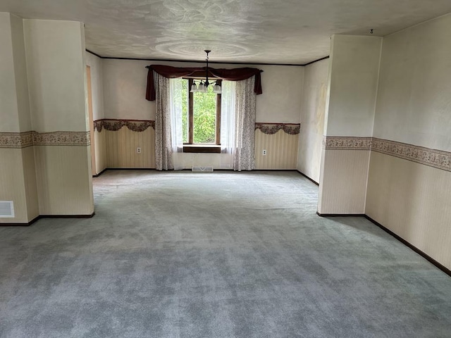 307 Debora Dr, Latrobe, PA 15650 - empty room featuring a chandelier, carpet floors, and wainscoting