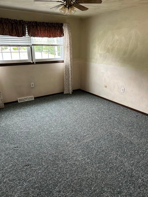 307 Debora Dr, Latrobe, PA 15650 - spare room featuring a ceiling fan and baseboards