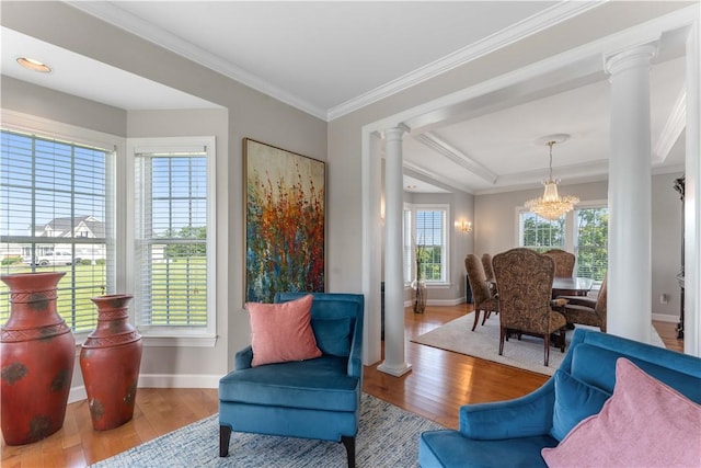 1002 Sunset Way, Menallen Twp, PA 15401 - sitting room featuring decorative columns, wood finished floors, a chandelier, and ornamental molding