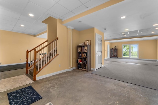 1002 Sunset Way, Menallen Twp, PA 15401 - unfurnished living room featuring a paneled ceiling, concrete flooring, recessed lighting, and stairway