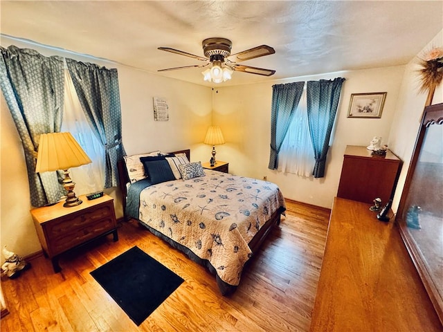 126 Preston Dr N, Braddock, PA 15104 - bedroom featuring wood finished floors and a ceiling fan