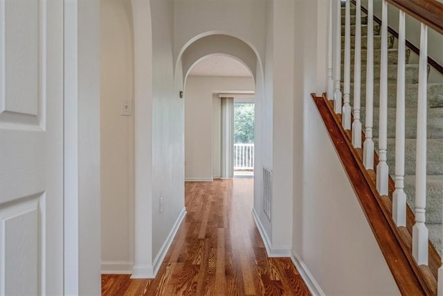 520 Panorama Dr, Cecil, PA 15317 - corridor with wood finished floors, arched walkways, and stairs