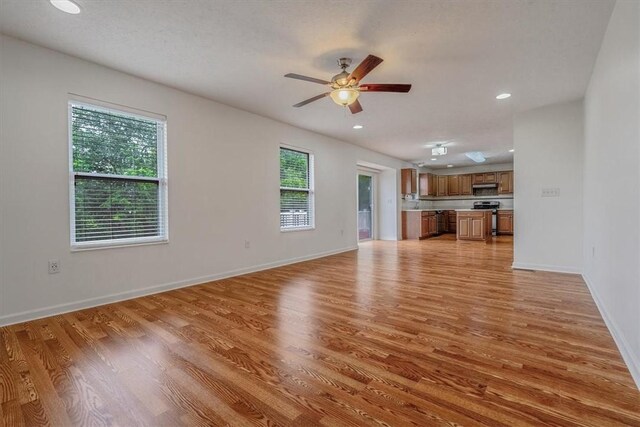 520 Panorama Dr, Cecil, PA 15317 - unfurnished living room with light wood-style flooring, ceiling fan, and recessed lighting