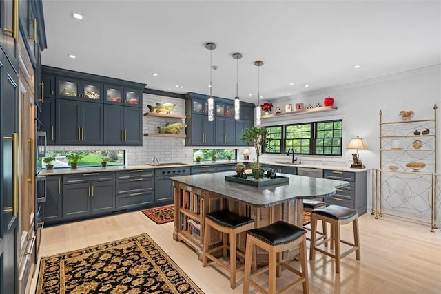2356 Morrow Rd, Upper St Clair, PA 15241 - kitchen featuring open shelves, light wood finished floors, a kitchen bar, backsplash, and a kitchen island