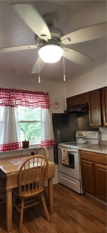180 Pleasantview Dr, Ohioville, PA 15059 - kitchen with electric stove, a ceiling fan, wood finished floors, under cabinet range hood, and light countertops