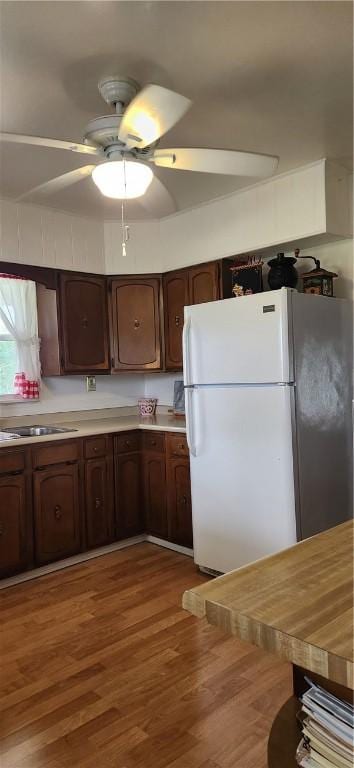 180 Pleasantview Dr, Ohioville, PA 15059 - kitchen featuring freestanding refrigerator, a ceiling fan, light countertops, wood finished floors, and dark brown cabinetry