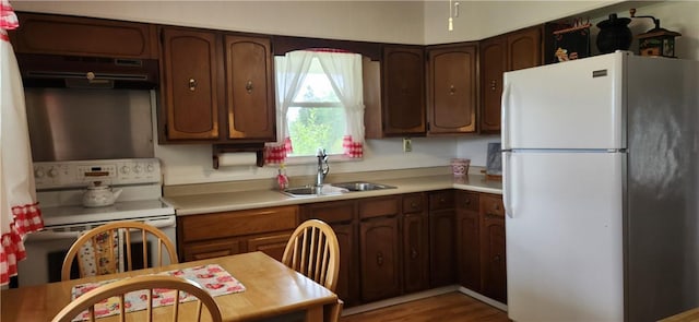 180 Pleasantview Dr, Ohioville, PA 15059 - kitchen with white appliances, under cabinet range hood, light countertops, and wood finished floors