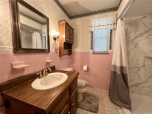 240 Reed St, Lower Burrell, PA 15068 - bathroom featuring a shower with curtain, vanity, tile walls, wainscoting, and wallpapered walls