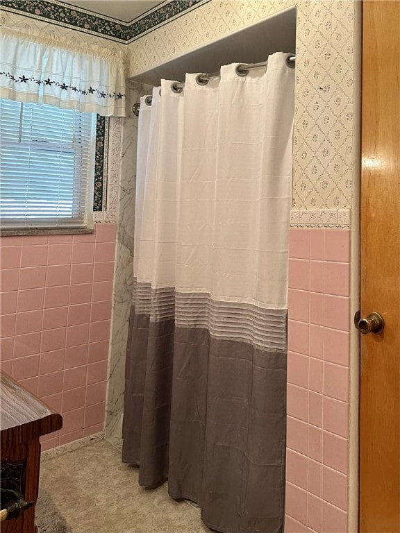 240 Reed St, Lower Burrell, PA 15068 - bathroom featuring wallpapered walls, tile walls, wainscoting, and a shower with curtain