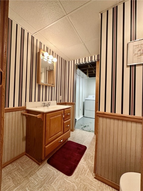 240 Reed St, Lower Burrell, PA 15068 - bathroom featuring washer / clothes dryer, vanity, and a drop ceiling