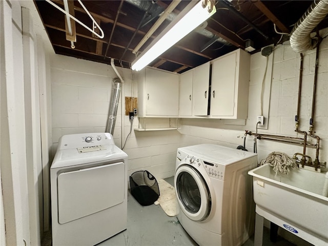 240 Reed St, Lower Burrell, PA 15068 - laundry room with independent washer and dryer, cabinet space, and concrete block wall