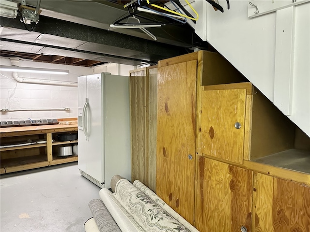 240 Reed St, Lower Burrell, PA 15068 - basement with white fridge with ice dispenser and concrete block wall