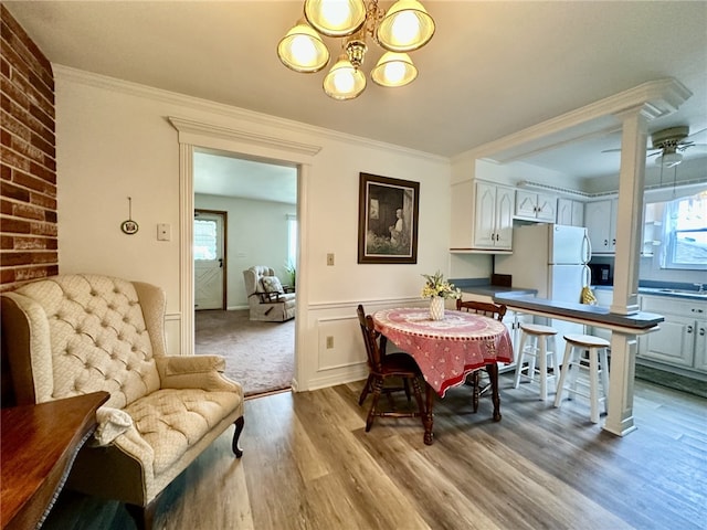 240 Reed St, Lower Burrell, PA 15068 - dining area featuring wood finished floors, a chandelier, and ornamental molding