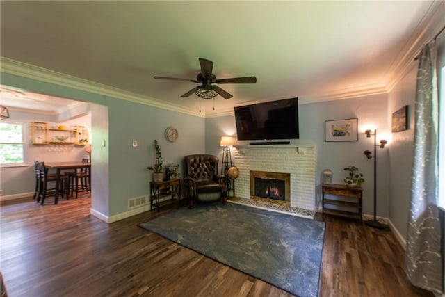 670 Lougeay Rd, Penn Hills, PA 15235 - living room featuring wood finished floors, ceiling fan, a fireplace, and crown molding