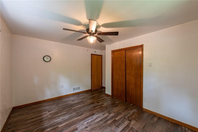 670 Lougeay Rd, Penn Hills, PA 15235 - unfurnished bedroom with dark wood-style floors, a closet, and ceiling fan