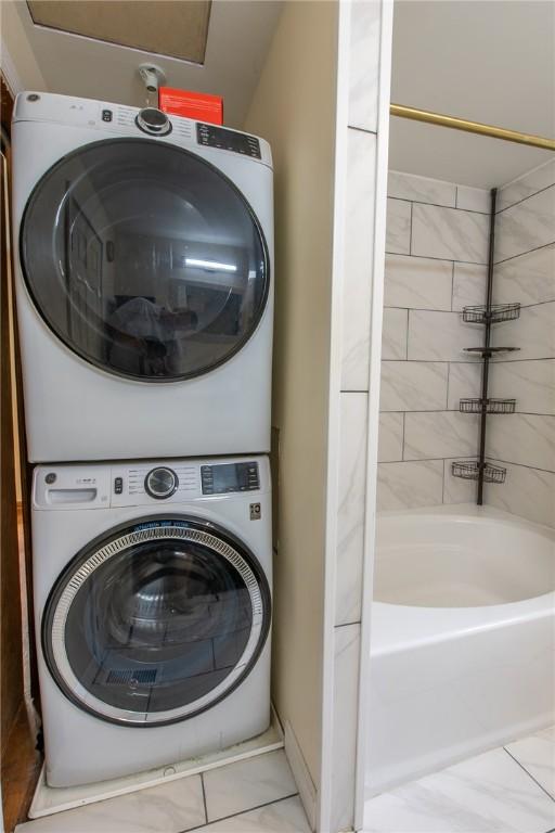 670 Lougeay Rd, Penn Hills, PA 15235 - laundry room featuring estacked washer and dryer