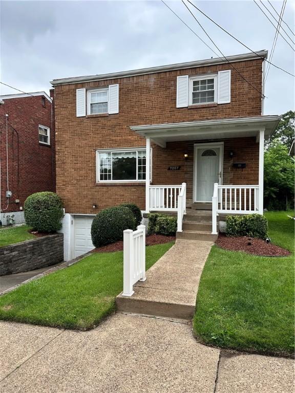 7207 Mcclure Ave, Swissvale, PA 15218 - view of front of property featuring brick siding and covered porch