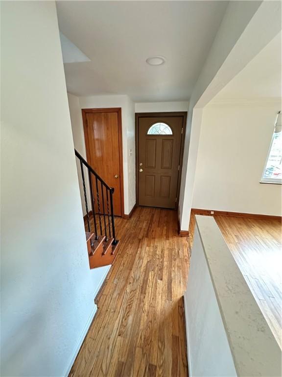 7207 Mcclure Ave, Swissvale, PA 15218 - foyer entrance with wood finished floors and stairs