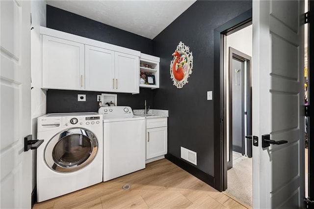 7858 Oscar Ct, North Huntingdon, PA 15642 - laundry area with cabinet space and washing machine and clothes dryer
