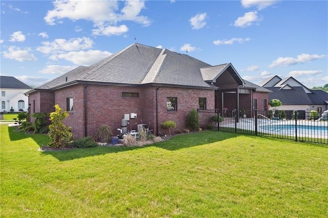 7858 Oscar Ct, North Huntingdon, PA 15642 - rear view of property featuring brick siding and roof with shingles