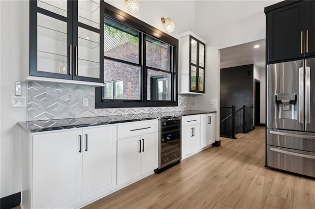 7858 Oscar Ct, North Huntingdon, PA 15642 - kitchen with stainless steel fridge with ice dispenser, wine cooler, glass insert cabinets, and dark stone countertops