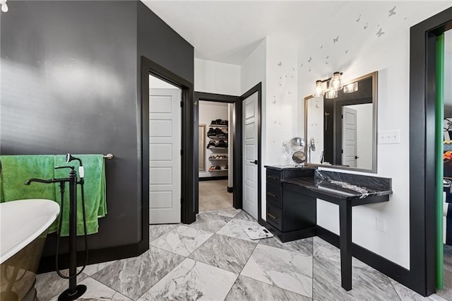 7858 Oscar Ct, North Huntingdon, PA 15642 - bathroom with a freestanding tub, marble look tile flooring, and a walk in closet