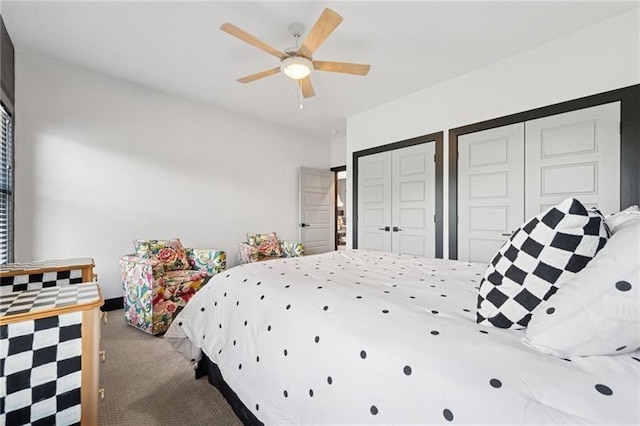 7858 Oscar Ct, North Huntingdon, PA 15642 - carpeted bedroom featuring multiple closets and ceiling fan