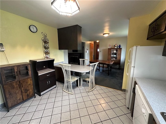 1020 Grove St, Hempfield Twp Wml, PA 15601 - kitchen featuring light countertops, white appliances, light tile patterned flooring, and a fireplace