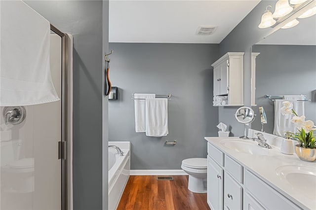 161 Buckingham Dr, Ohio Twp, PA 15237 - full bath featuring wood finished floors, a shower stall, double vanity, and a garden tub