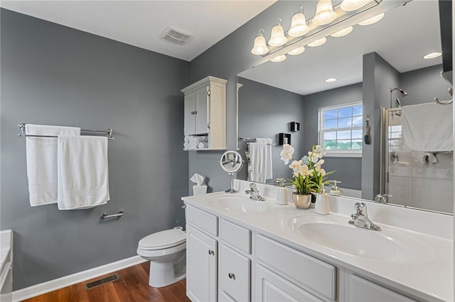 161 Buckingham Dr, Ohio Twp, PA 15237 - bathroom featuring wood finished floors, a shower with shower door, double vanity, and a bathtub