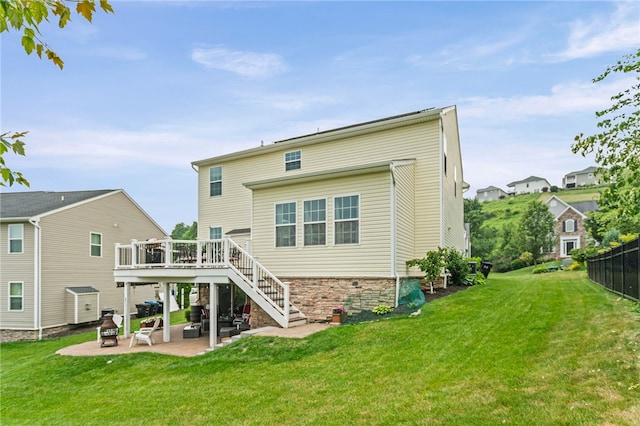 161 Buckingham Dr, Ohio Twp, PA 15237 - back of property featuring stairs, a patio, a wooden deck, and a lawn