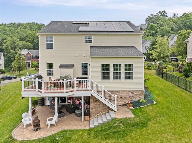161 Buckingham Dr, Ohio Twp, PA 15237 - back of property featuring a patio area, a deck, solar panels, an outdoor living space with a fire pit, and stairs