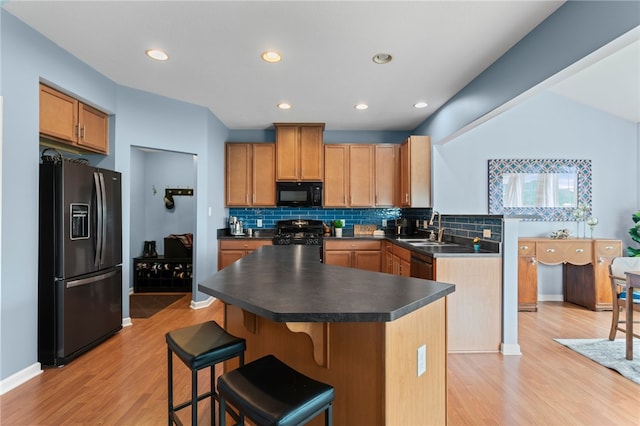 161 Buckingham Dr, Ohio Twp, PA 15237 - kitchen featuring black appliances, light wood-style flooring, dark countertops, tasteful backsplash, and recessed lighting