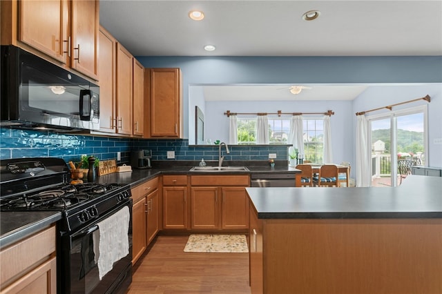 161 Buckingham Dr, Ohio Twp, PA 15237 - kitchen featuring black appliances, light wood-type flooring, dark countertops, tasteful backsplash, and recessed lighting