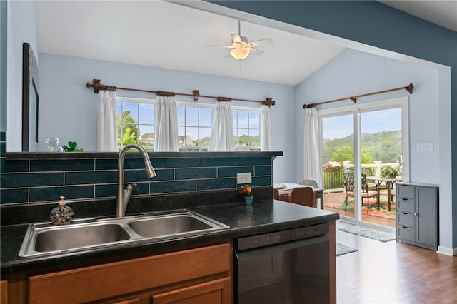 161 Buckingham Dr, Ohio Twp, PA 15237 - kitchen with black dishwasher, dark countertops, healthy amount of natural light, lofted ceiling, and brown cabinetry