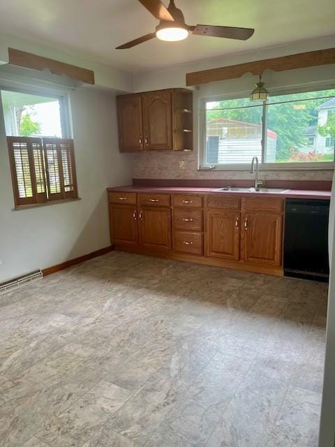 82 Crossridge, Crossridge, PA 15022 - kitchen featuring black dishwasher, ceiling fan, plenty of natural light, and brown cabinets