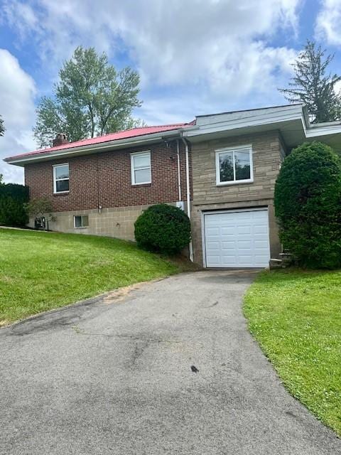 82 Crossridge, Crossridge, PA 15022 - view of side of property with driveway, an attached garage, and a yard