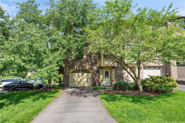 617 Woodcrest Dr, Robinson Twp Nwa, PA 15205 - view of front of home featuring brick siding, asphalt driveway, and a front lawn